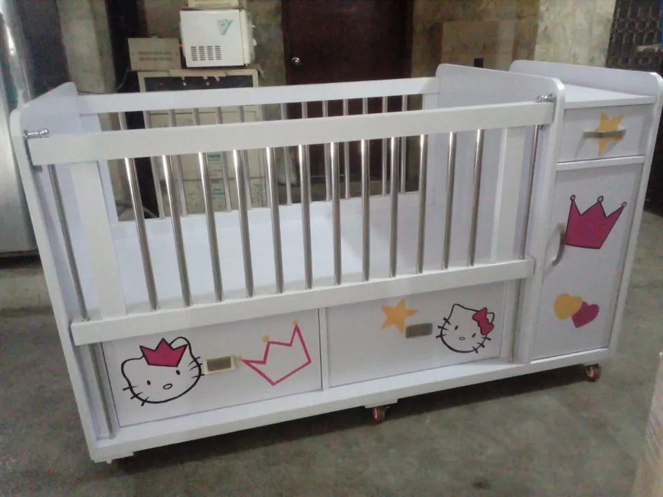 White Baby Cot with Cat Drawers